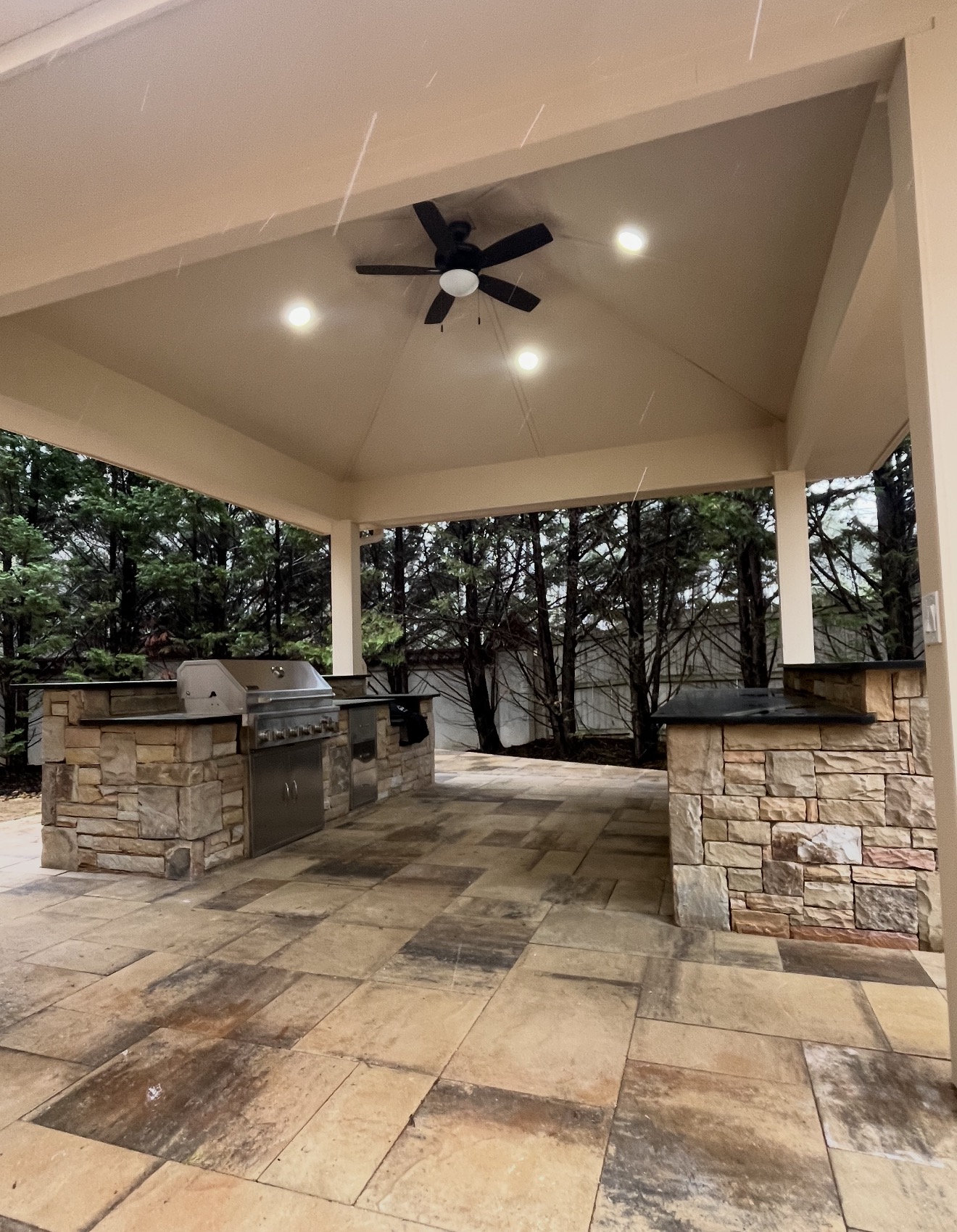 Vaulted pavilion with stacked stone grill island